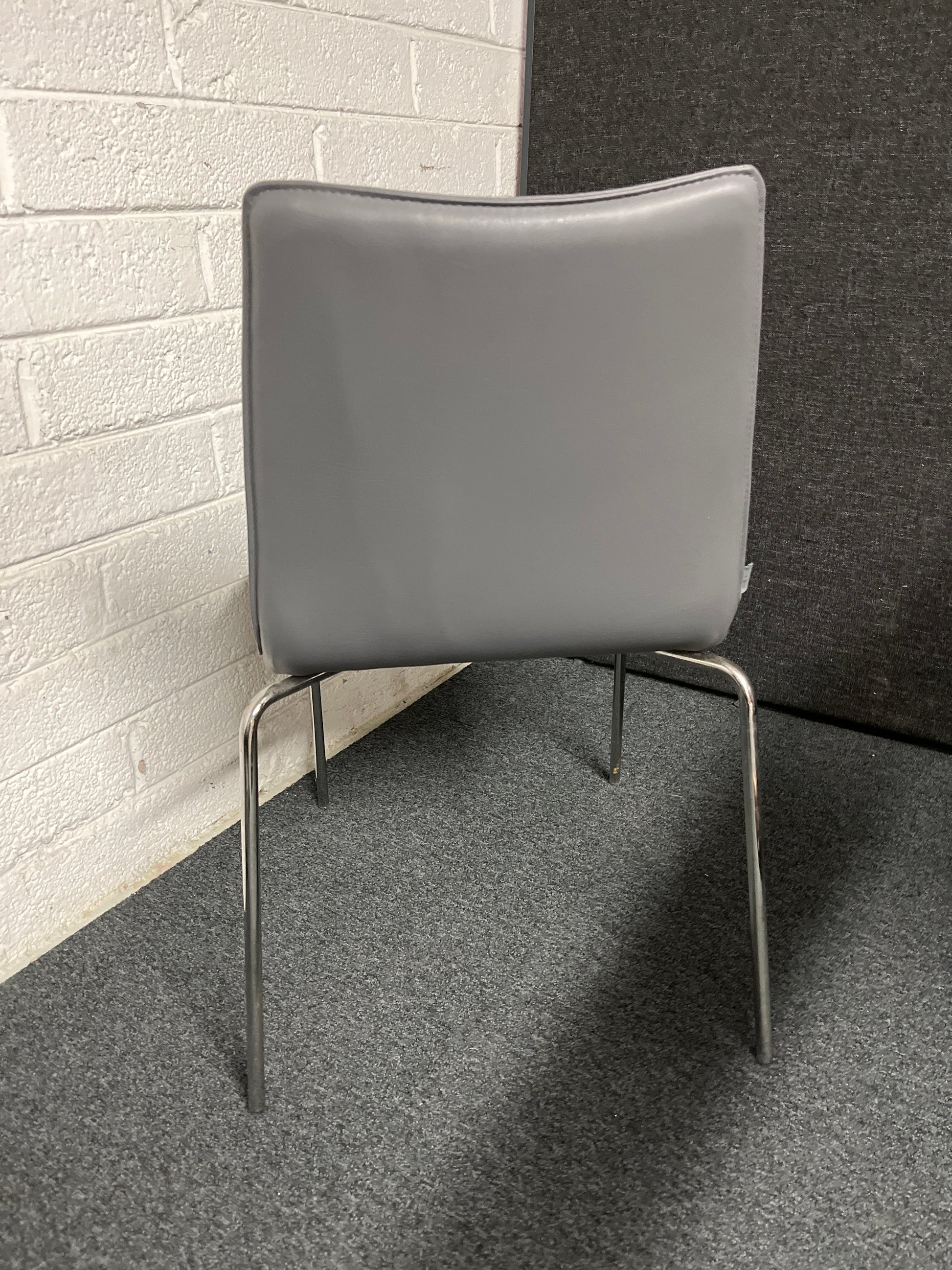 BRAND NEW Torre Italian stackable chair, chrome frame with grey leather seat and back. 4124
