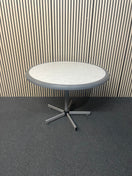 White circular plastic top table with 4 grey metal dining chairs 44652