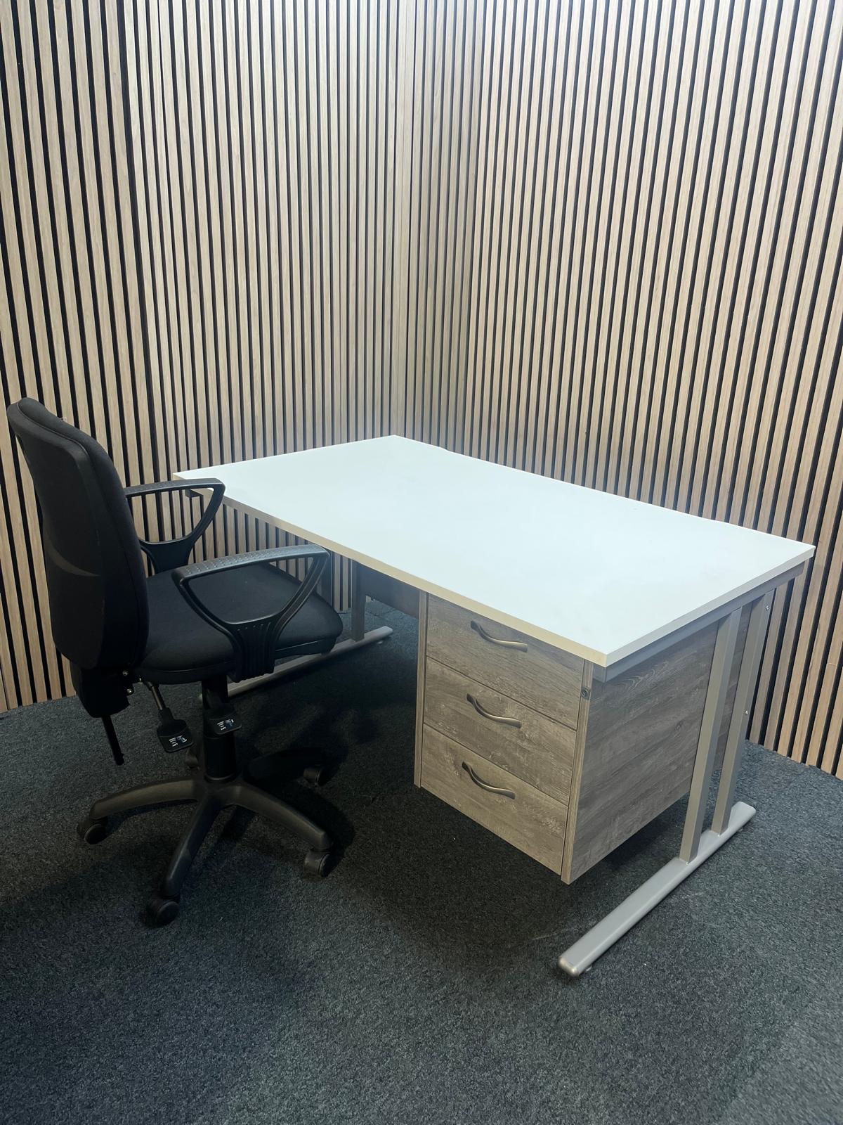 ( GRADE A) White 1400 x 800 desk with grey oak fixed pedestal + (GRADE A) Black fabric swivel chair bundel