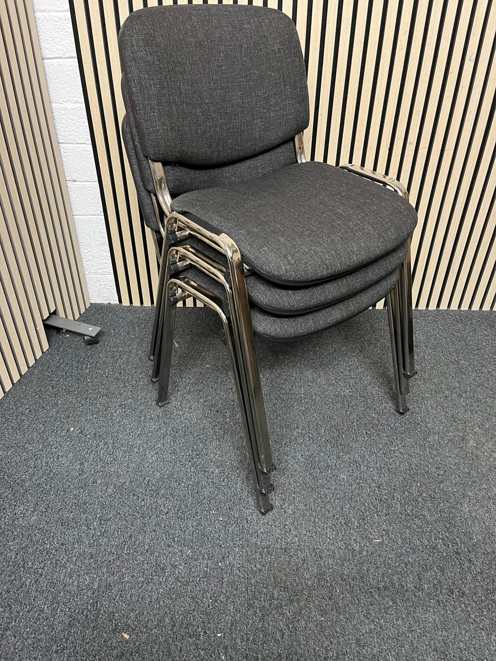 Chrome framed, charcoal fabric seat and back, stacking chair