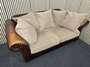 Two-seater sofa with leather frame, fabric cushions, and stud detailin W190x100D 44492