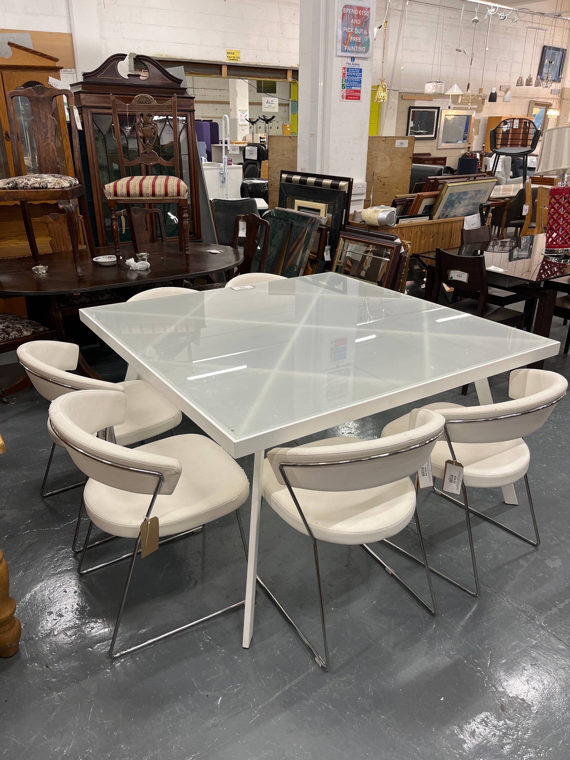 Calligaris Large white powder coated framed frosted glass table (W 140 x L 140 cm) with 6 no chrome framed, white leatherette club chairs 3225