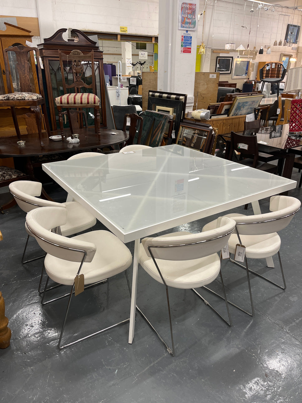 Calligaris Large white powder coated framed frosted glass table (W 140 x L 140 cm) with 6 no chrome framed, white leatherette club chairs 3225