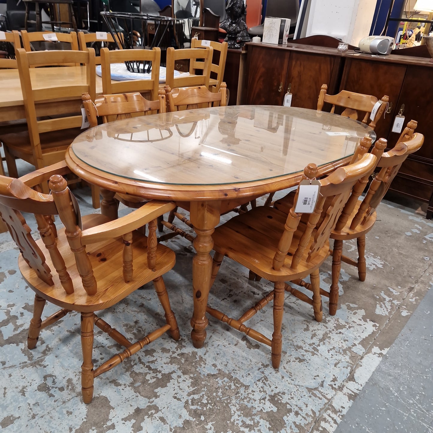 Solid natural pine oval extendable kitchen table with a glass top and with 6 no. chairs  Q4323