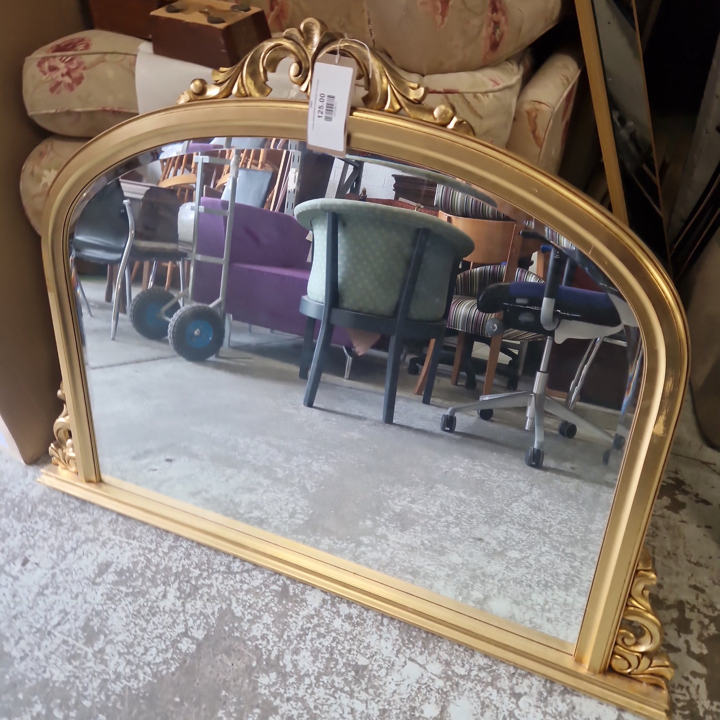 Ornate gold framed overmantle mirror