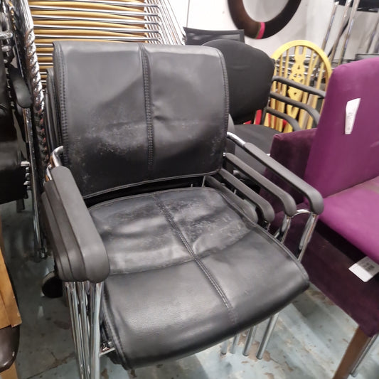 USED Black leatherette cantilever meeting chair with arms, polished chrome base, stackable