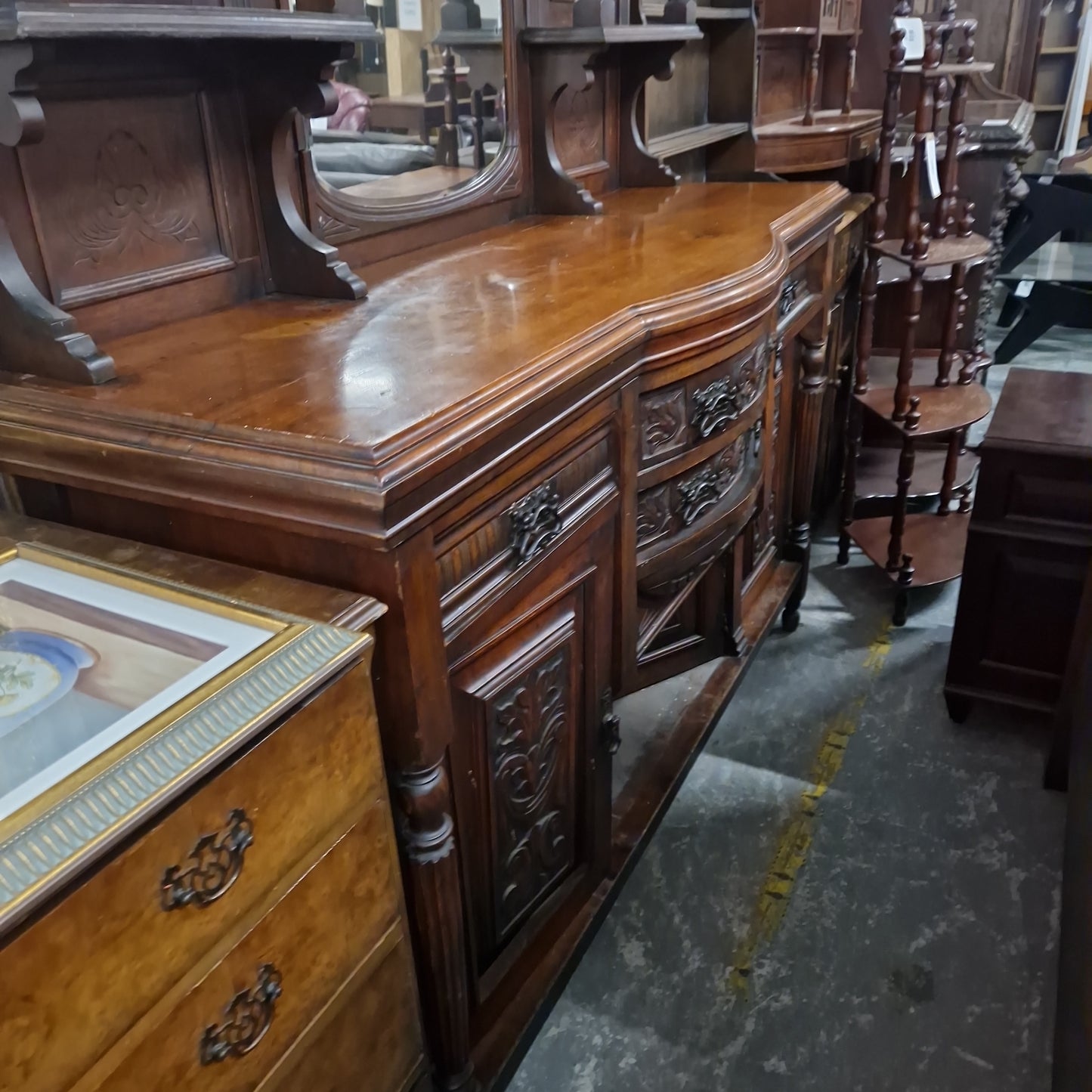 Large solid mahogany carved sideboard with back drop mirror and drawers
