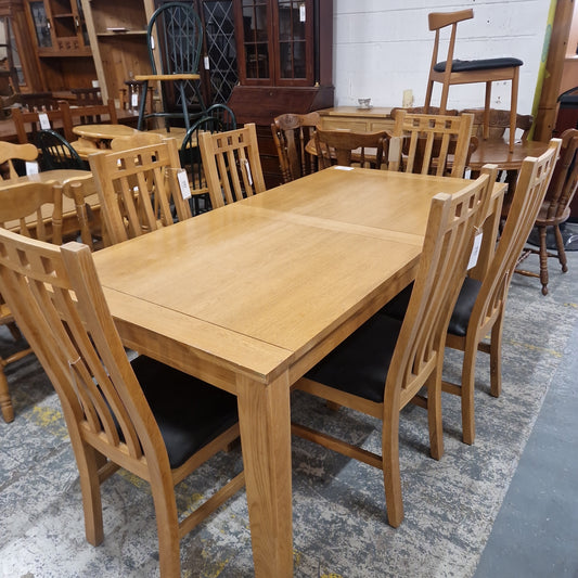 Large solid oak kitchen table with 6 no. matching chairs, high back brown leatherette seat