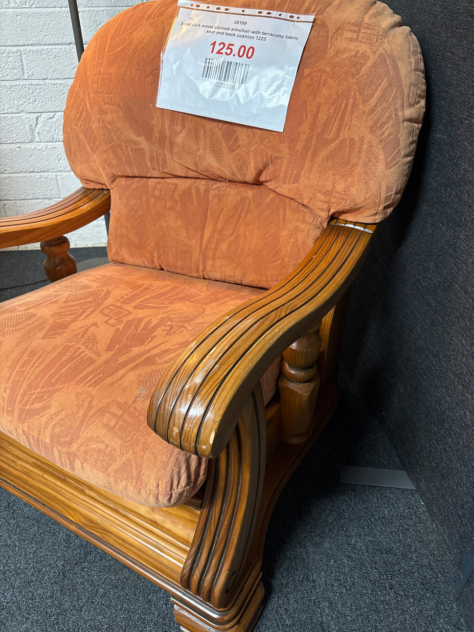 Solid dark wood stained armchair with terracotta fabric seat and back cushion 1225