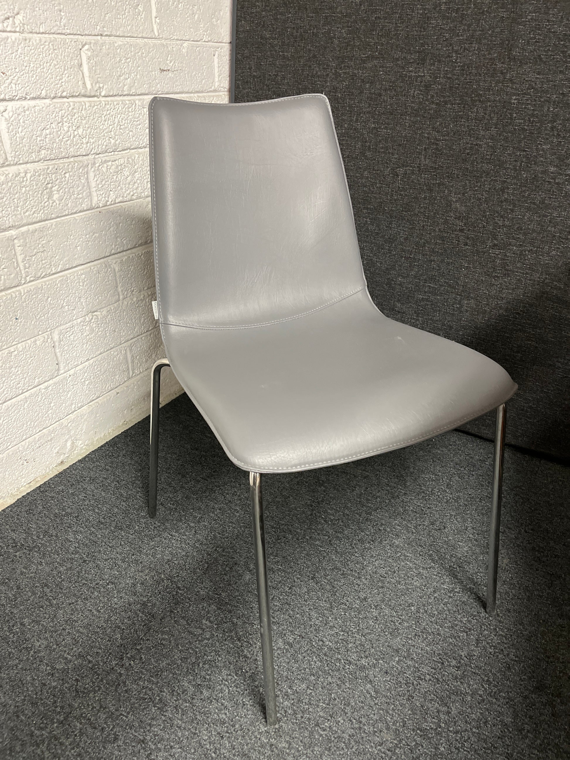 BRAND NEW Torre Italian stackable chair, chrome frame with grey leather seat and back. 4124