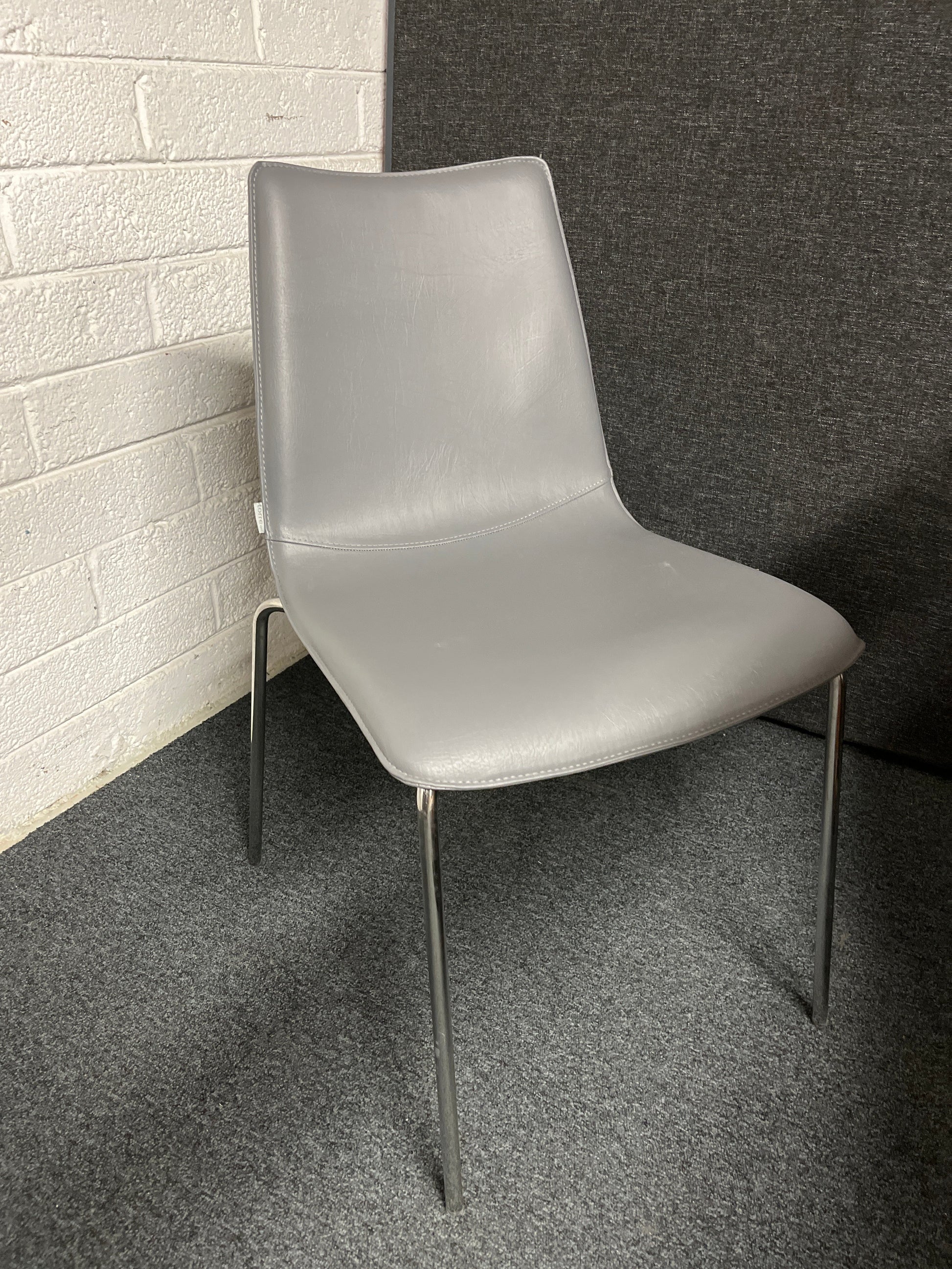 BRAND NEW Torre Italian stackable chair, chrome frame with grey leather seat and back. 4124
