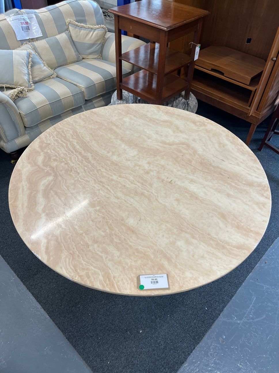 Cream marble effect circular 1300Wx760H central podium base dining table, note damage to parts of edge 2225