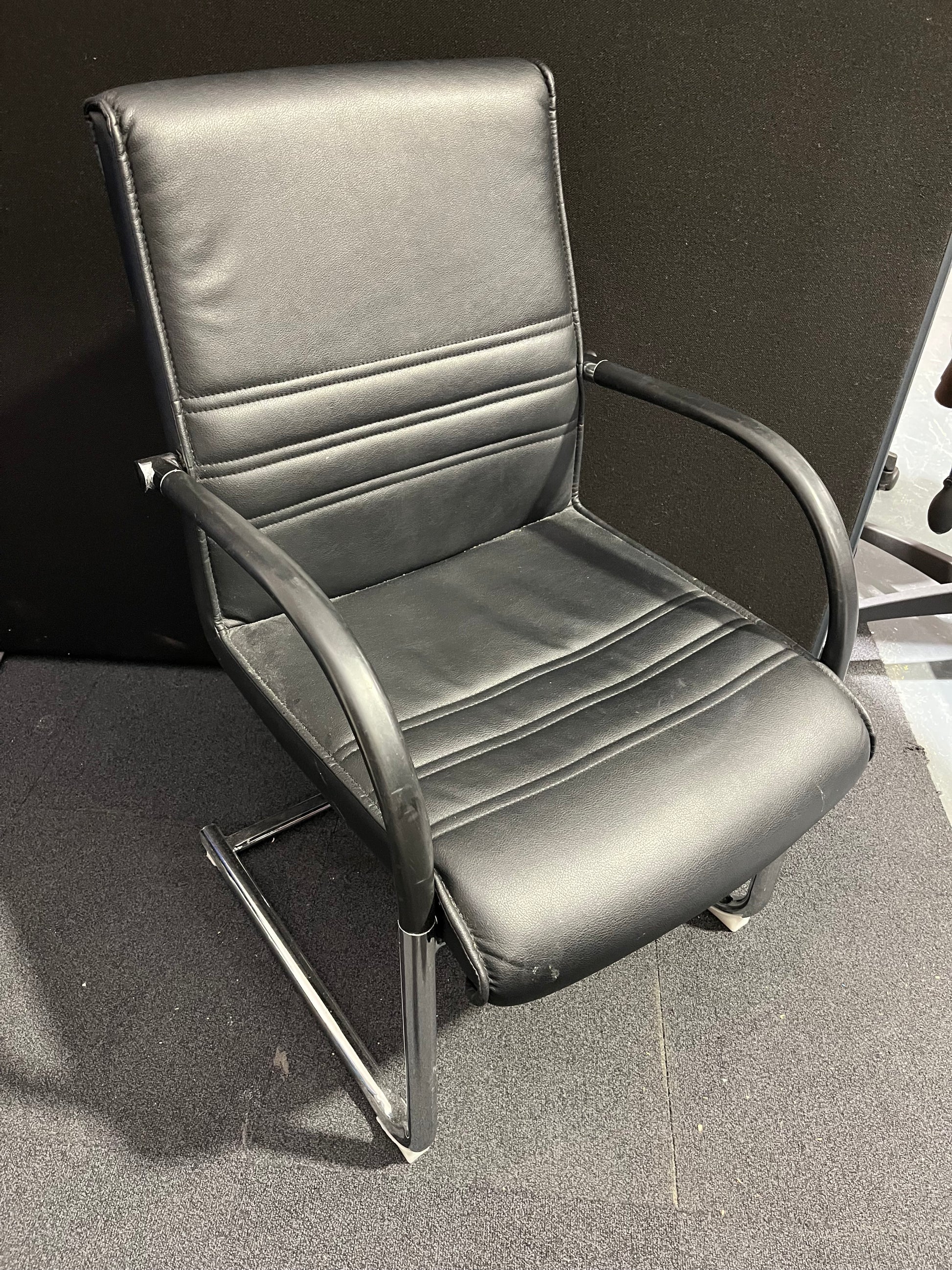 Black leather cantilever meeting chair with chrome frame