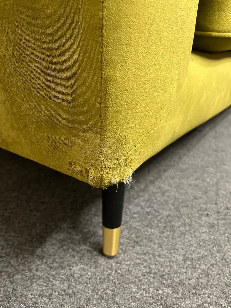 Modern olive green velvet sofa with vertical channel tufting, 2 seat cushions and slim black legs assencted with gold tips( W x 197 L x 81 H x 73 cm)