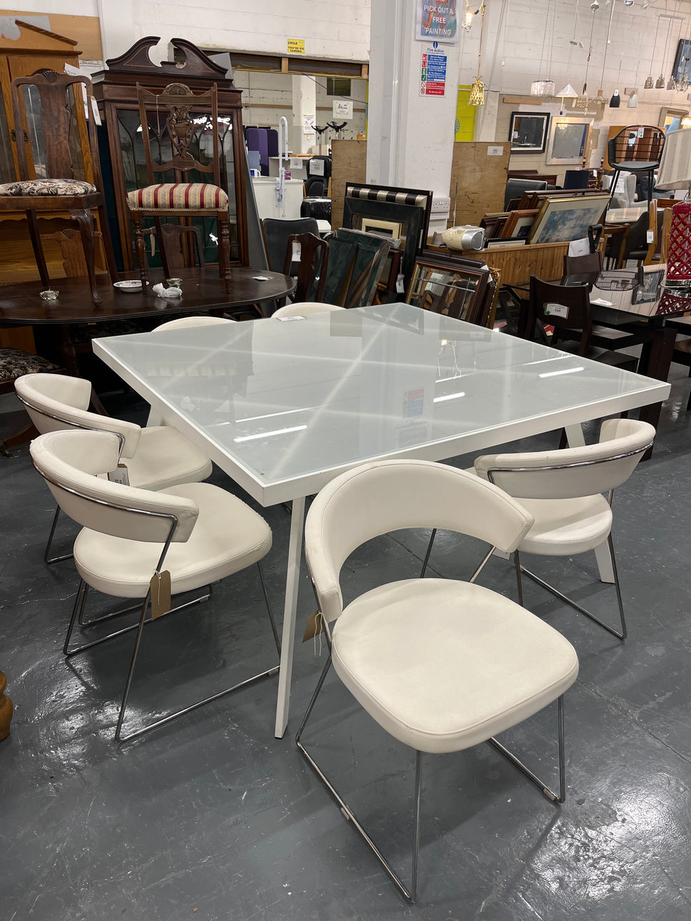 Calligaris Large white powder coated framed frosted glass table (W 140 x L 140 cm) with 6 no chrome framed, white leatherette club chairs 3225
