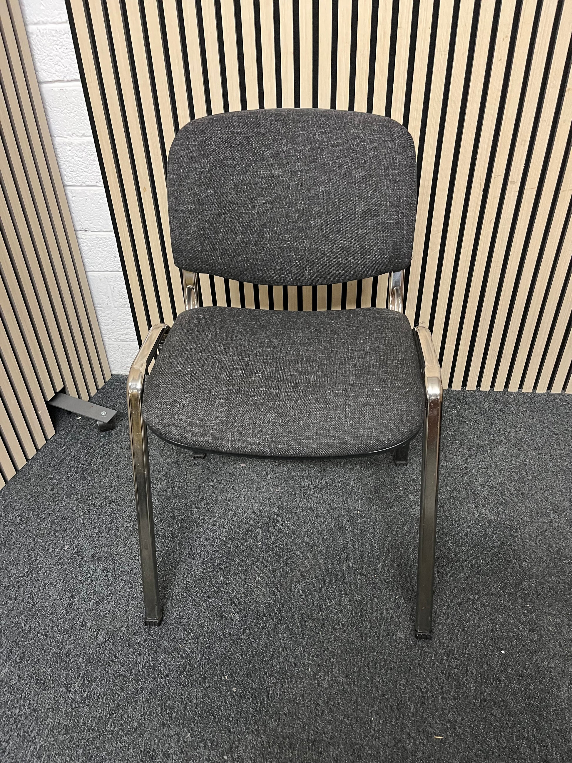 Chrome framed, charcoal fabric seat and back, stacking chair