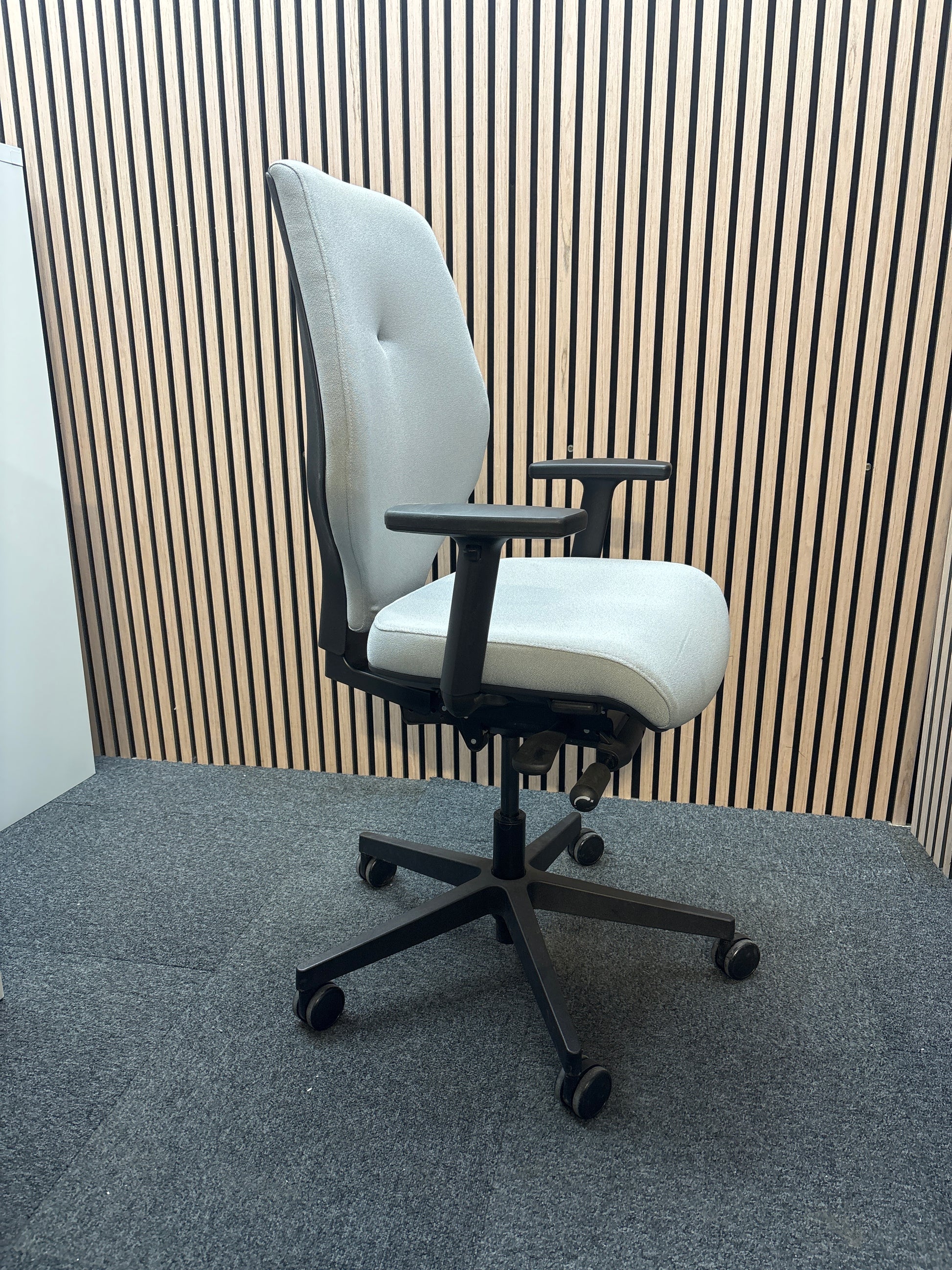 Grey secondhand fabric swivel chair with adjustable arms and 5 star swivel base