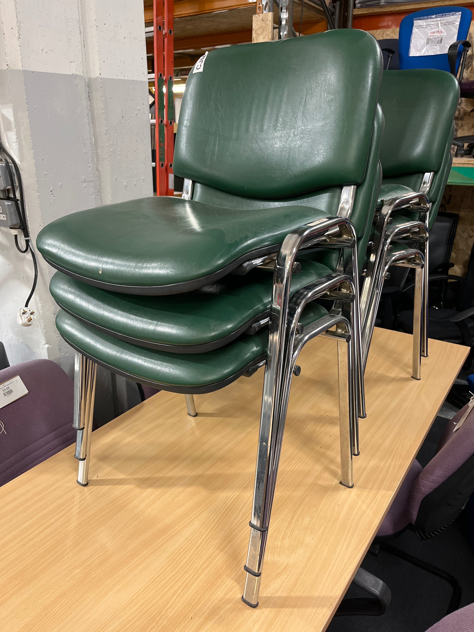 Green vinyl stacking meeting chair, chrome frame