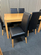 Rectangular beech dining table (L 150 x W 90 cm) with 6 black leatherette dining chairs 43505