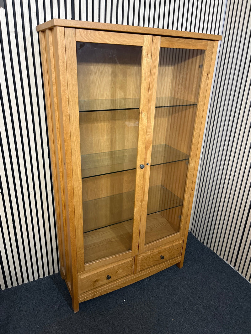 Solid oak display cabinet with glass doors,base drawer and internal lighting (h 183 x w 100 x d 40 cm) 44286