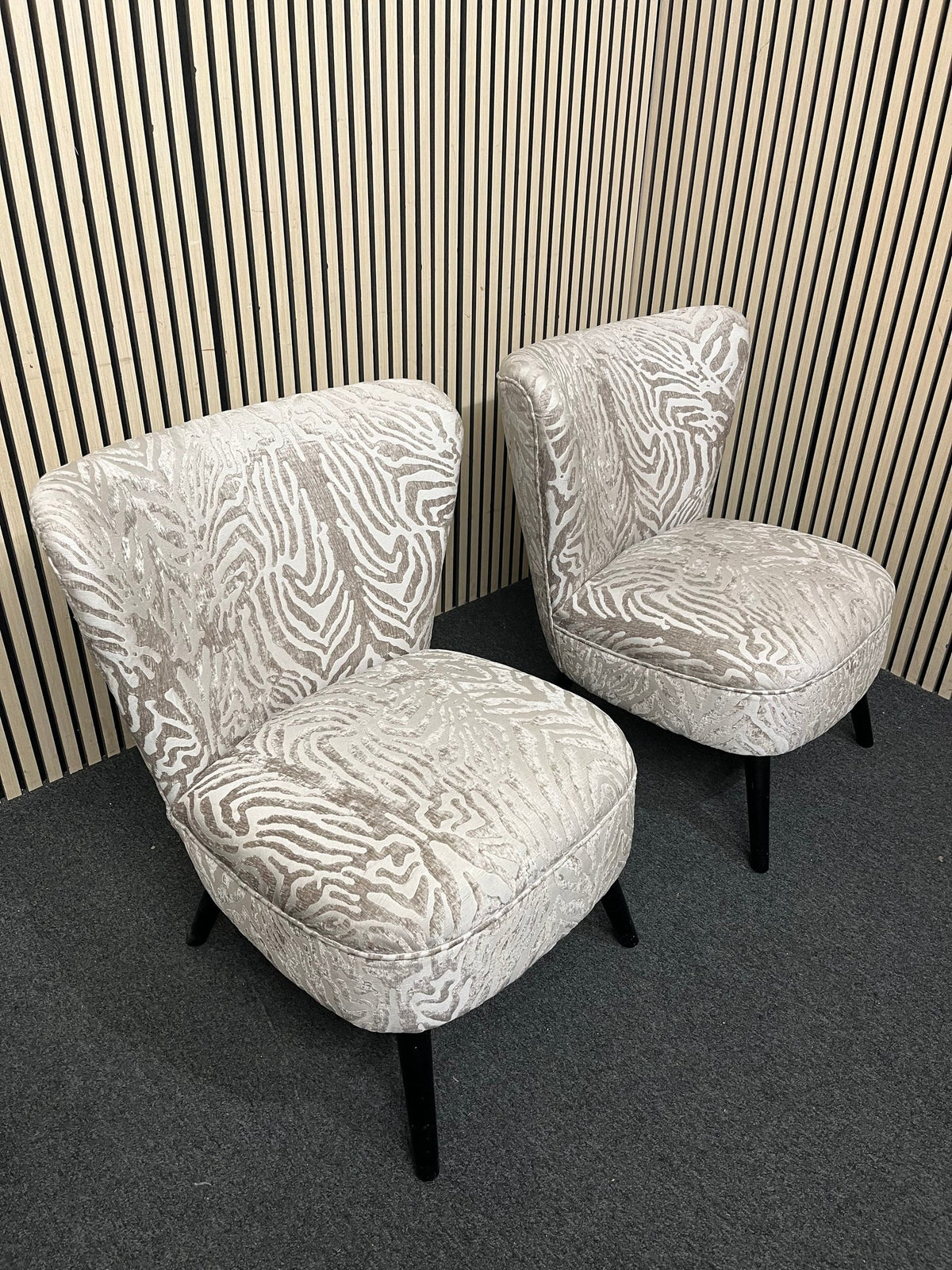 Armless accent chair with zebra pattern velvet and black legs. 44354