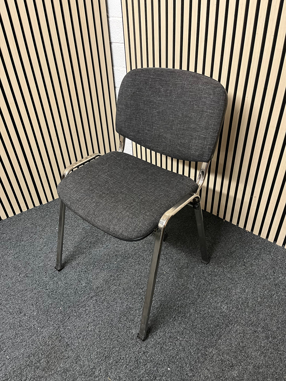 Chrome framed, charcoal fabric seat and back, stacking chair