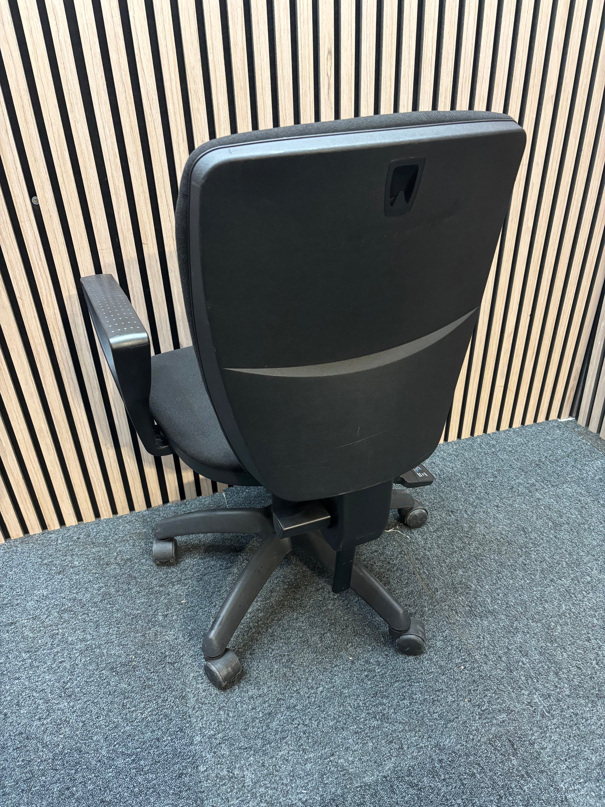 Black fabric swivel chair with black plastic fixed arms and 5 star swivel base
