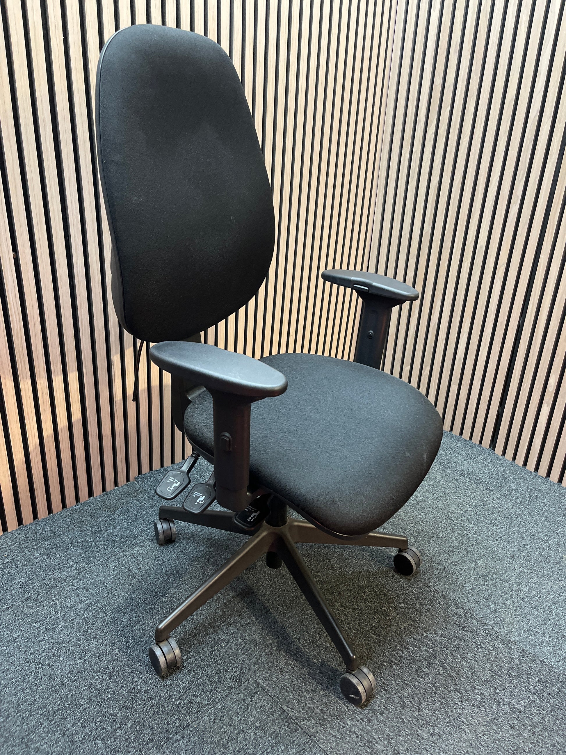 Black fabric ortho swivel
chair with adjustable arms and pump up lumbar support