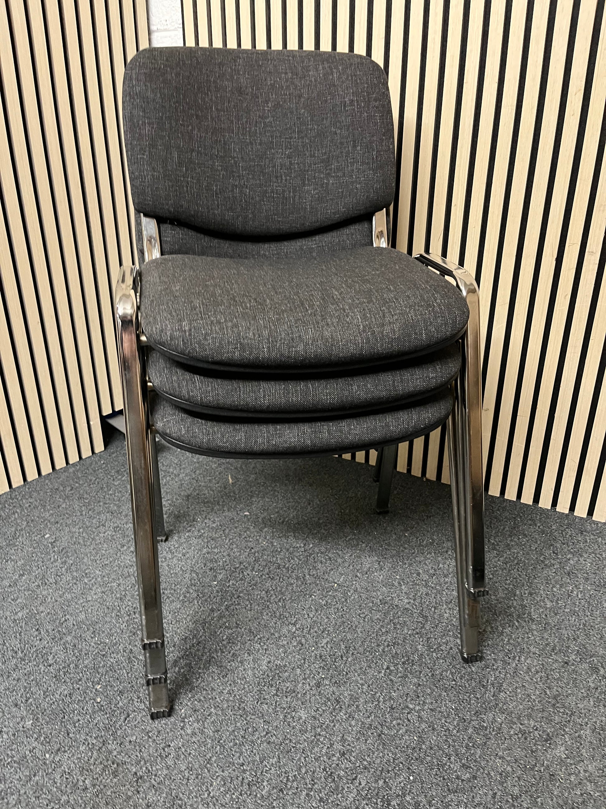 Chrome framed, charcoal fabric seat and back, stacking chair