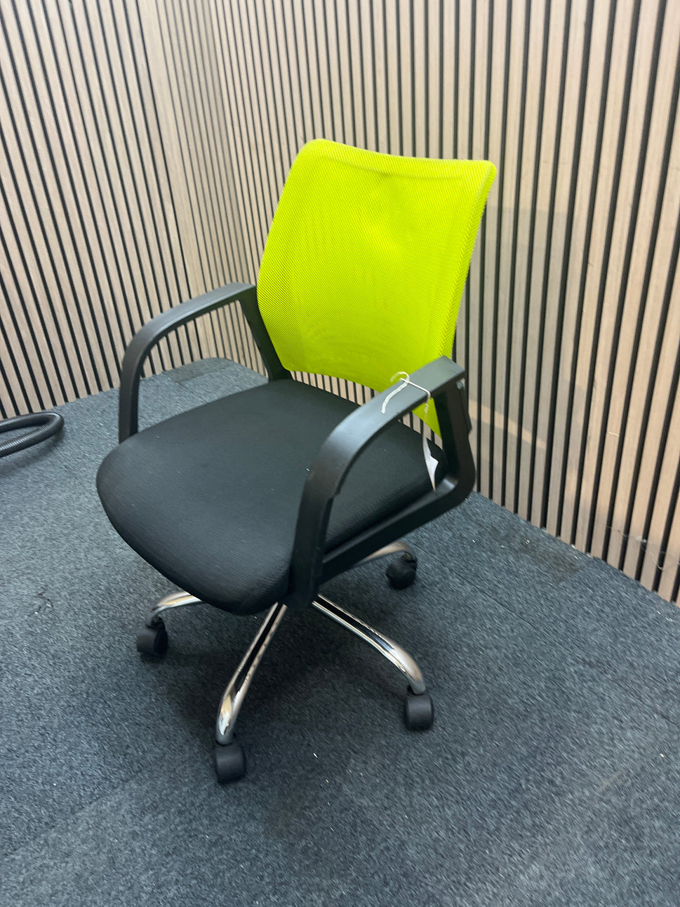 Neon green and black fabric swivel chair with loop arms