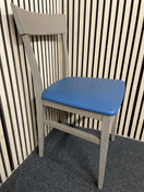 Modern grey cafe chair with blue faux leather seat. 44552