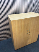 Medium 2 door oak laminate storage unit with internal metal shelves and handles. 120Hx102Wx55D J3920