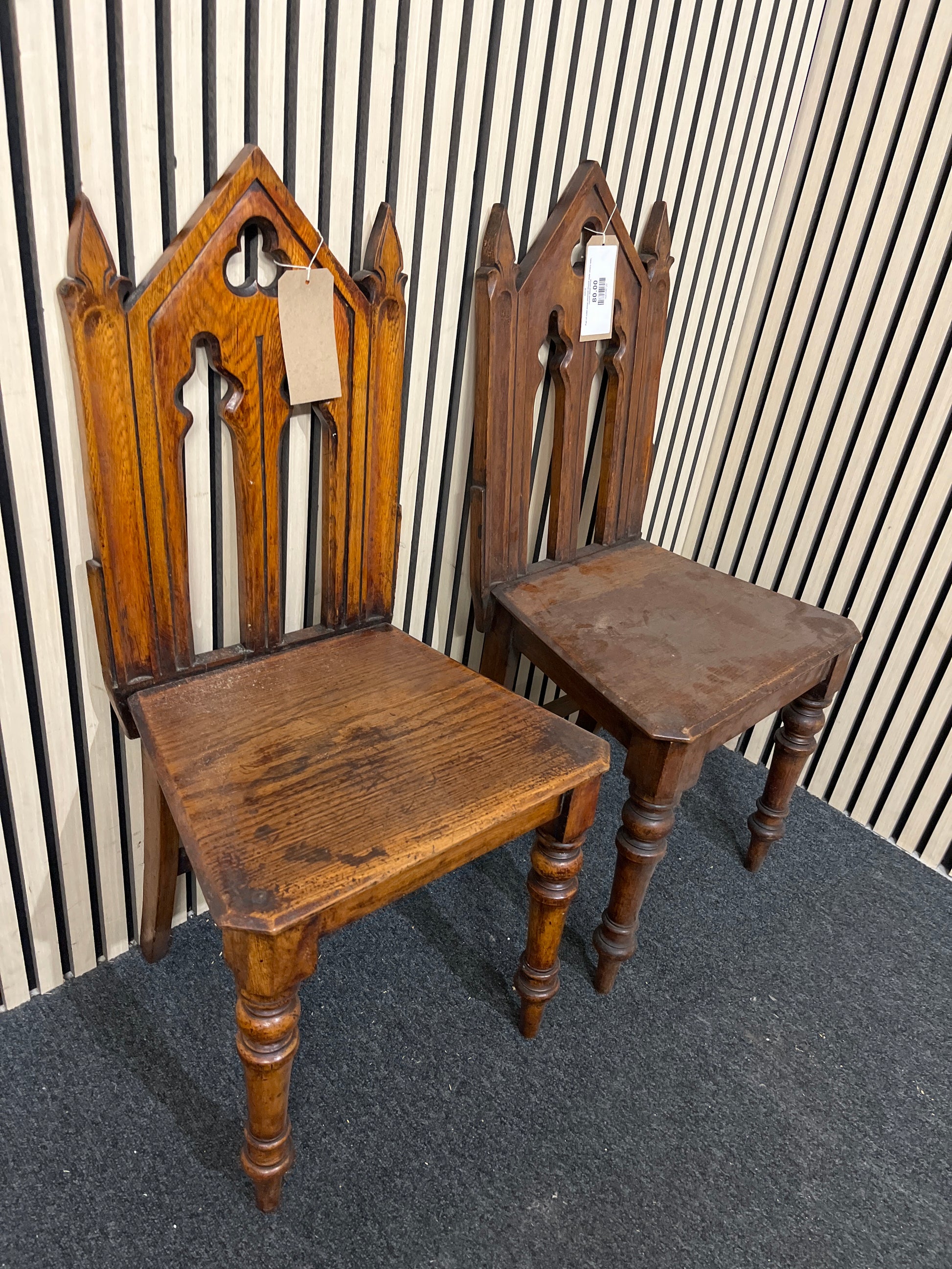 Pair of solid wood stsained church style chairs with carved detail 43538