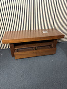Low-profile dark wood entertainment unit featuring two integrated storage drawers. 44709