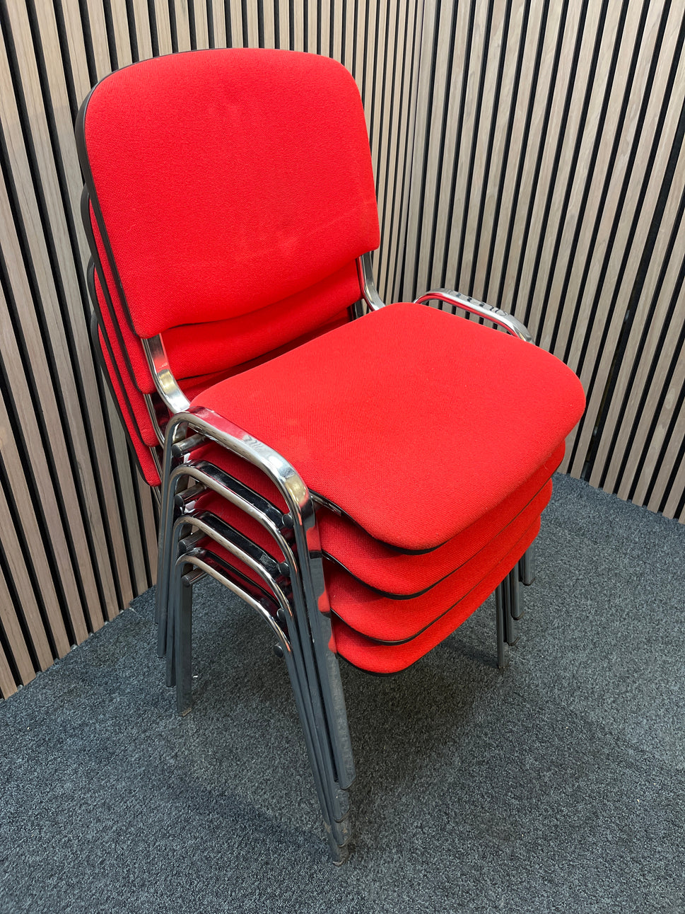 Red fabric stacking conference chair with chrome frame
