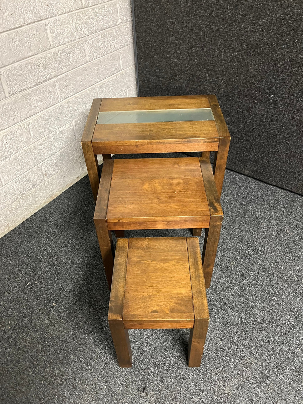 Dark wood stained solid wood nest of 3 tables with glass strip 1225