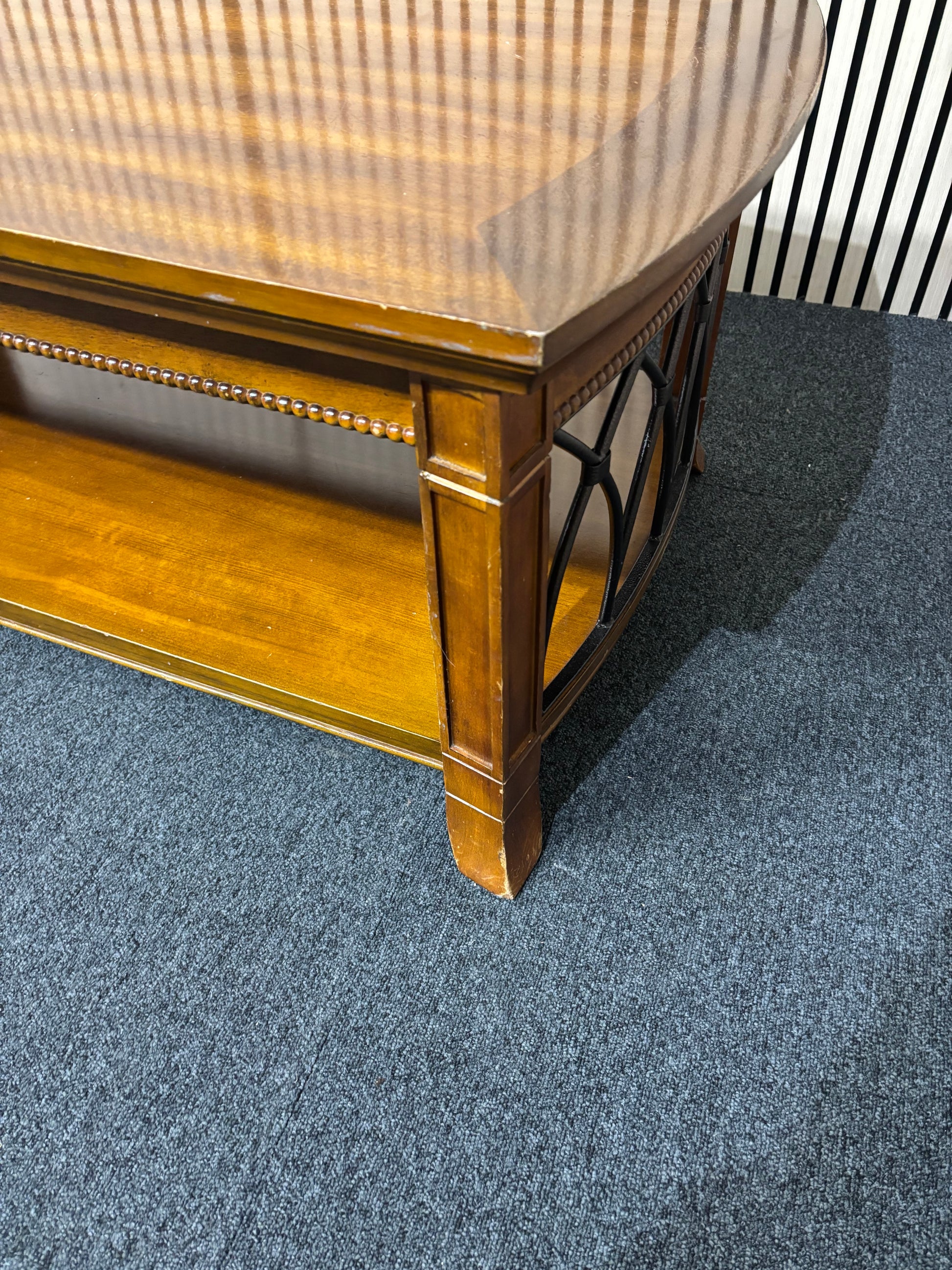 Solid dark wood stained low rectangular coffee table with ornate black metal details 2425