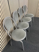 White circular plastic top table with 4 grey metal dining chairs 44652