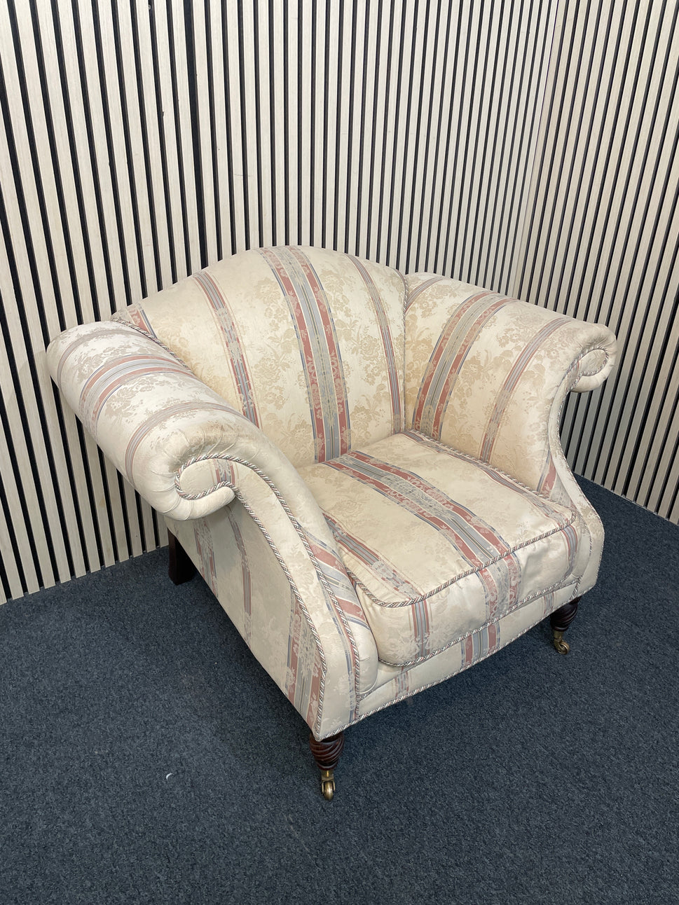 Ornate roll back stripped fabric armchair with castors 2425