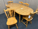 Oak laminate oval extendable dining table with 6 no. matching solid wood chairs W148 to 188 extended x 87D 44459