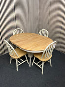 Round light wood dining table with four matching spindle chairs (diameter 105 cm + 45 cm extension) 44560