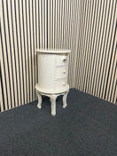 Oval three-drawer bedside locker with cabriole legs and cream finish. 44701