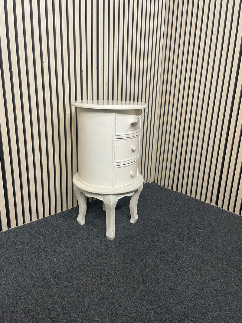 Oval three-drawer bedside locker with cabriole legs and cream finish. 44701