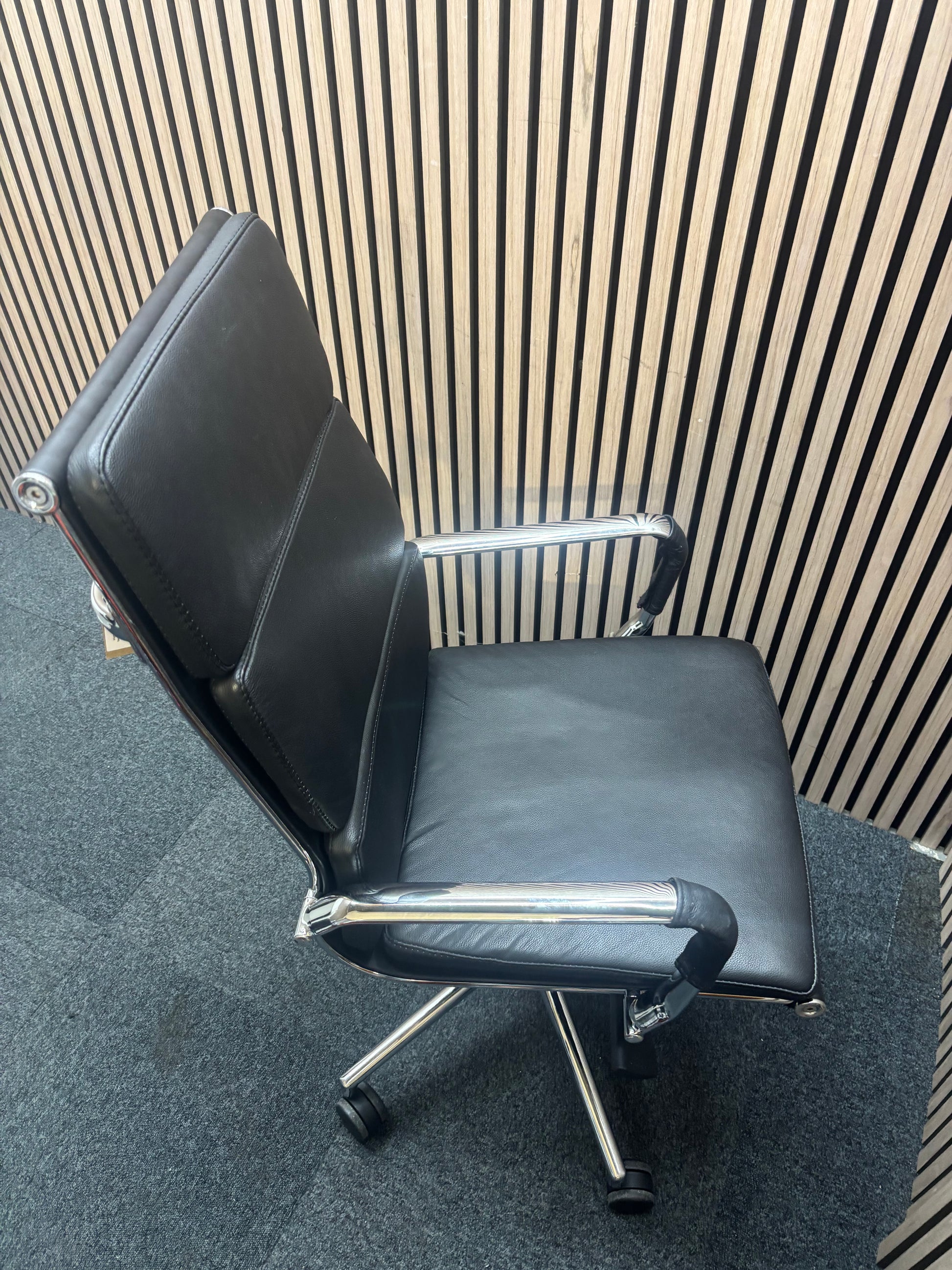 High back real black leather Eames style tall executive height adjustable swivel chair with polished chrome arms and base J3912