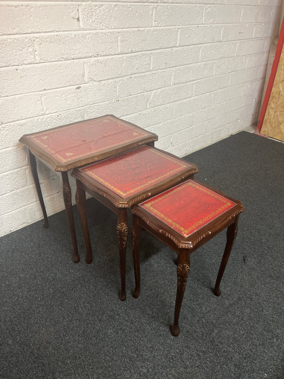 Mahogany nest of tables with glass top and carved detailing 1325