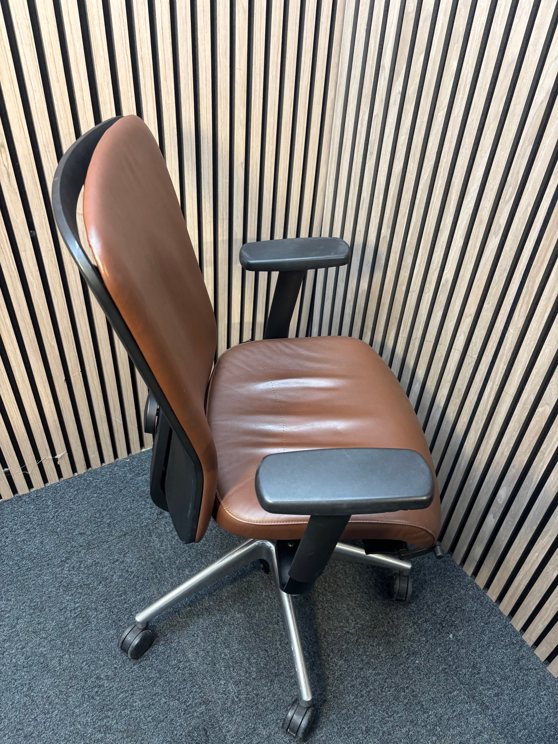 Girsberger high back brown leather multifunction swivel chair with adjustable arms and back rake with polished metal base on castors J3910