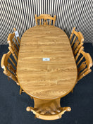 Oak laminate oval extendable dining table with 6 no. matching solid wood chairs W148 to 188 extended x 87D 44459