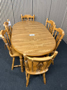 Oak laminate oval extendable dining table with 6 no. matching solid wood chairs W148 to 188 extended x 87D 44459