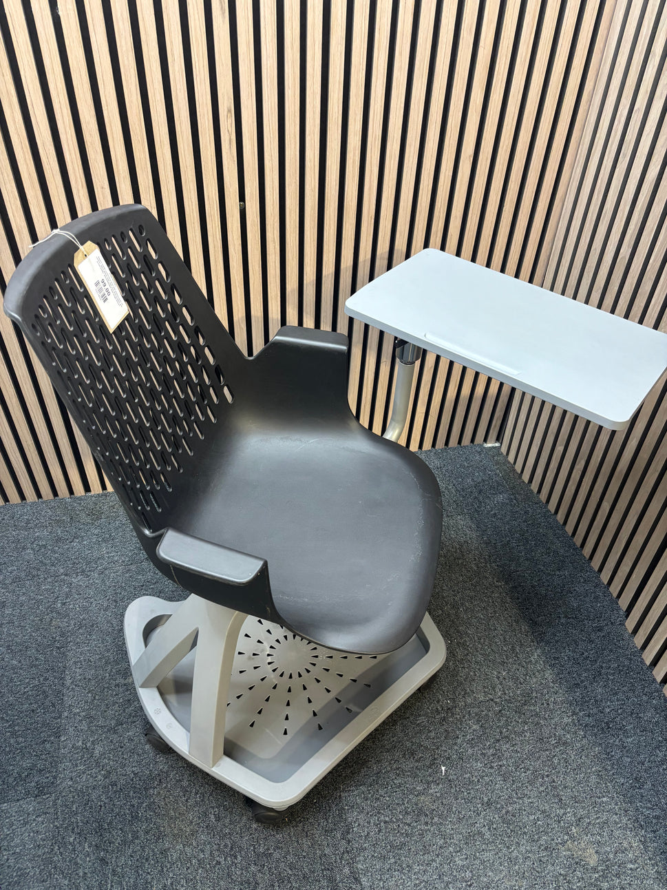Report mobile conference chair with writing tablet on castors, black plastic seat, dark grey writing tablet with drinks holder. 90Hx64Wx59H. Seat height 445mm