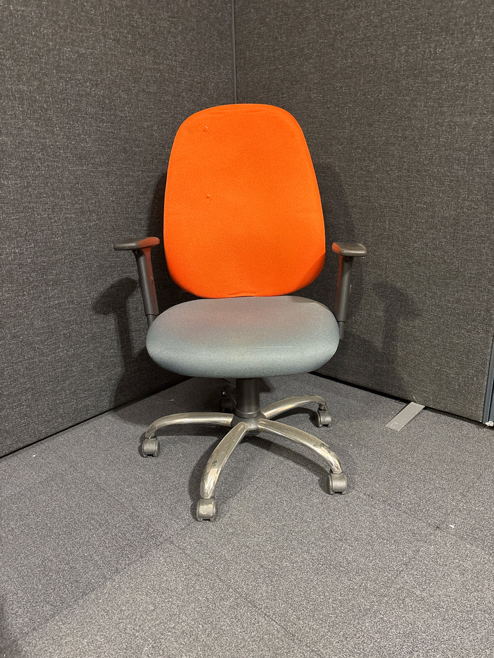 Two tone orange and grey high back swivel chair with height adjustable arms